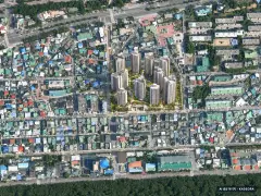 경화구역 재개발 총 1,415세대 기준 AI 상상도(주간 항공) — 실제와 다를 수 있음